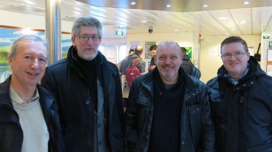 CRSC president Angus Ross (left) and cruise coordinator Neil Guthrie (right) with CalMac non-executive director Jim Stirling and managing director Martin Dorchester