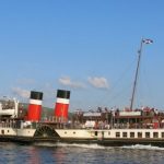 Waverley sailing from Keppel with her ensign at half mast as a tribute to Ian McMillan